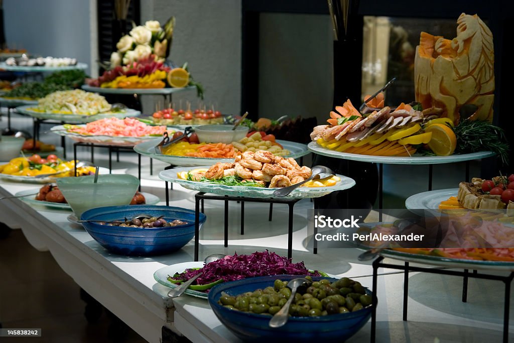 Table topped with many different plates and bowls of food Prepared food in plates ready for tasting Appetizer Stock Photo