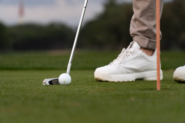 istock Low section shot of an -unrecognizable- golf player playing golf on a golf course 1458383083
