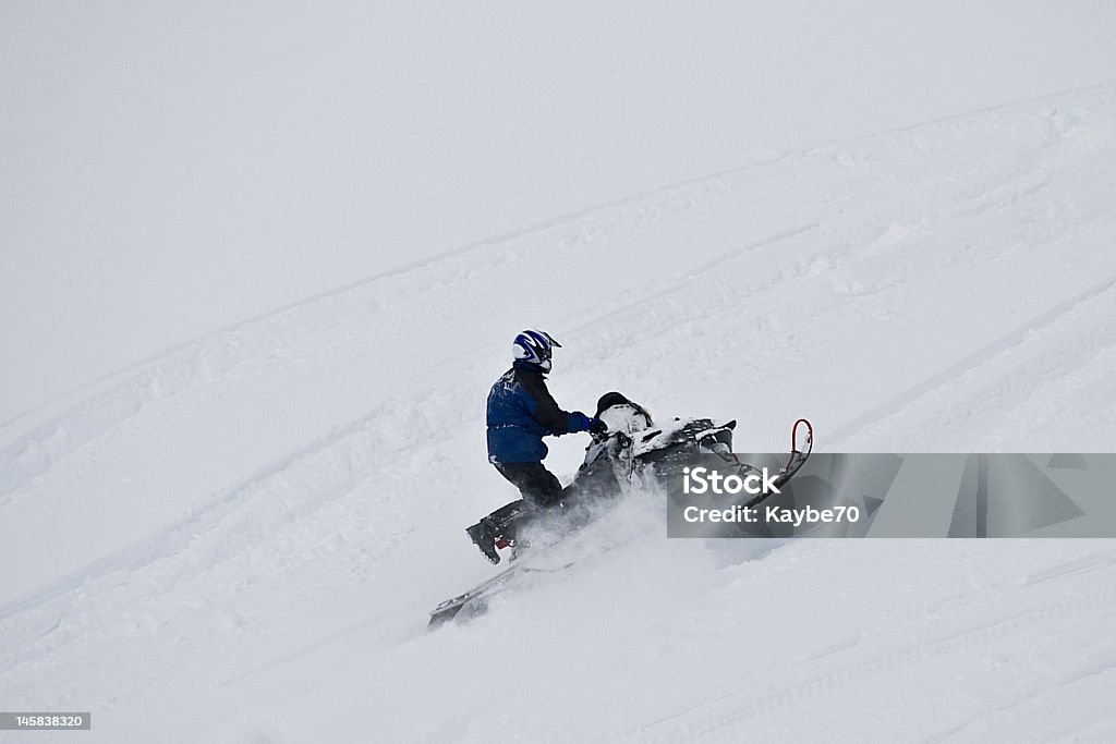 Extreme snowmobiling on mountain Snowmobiler climbing up mountain of fresh snow.  (see more snowmobilers in my portfolio.) Adult Stock Photo