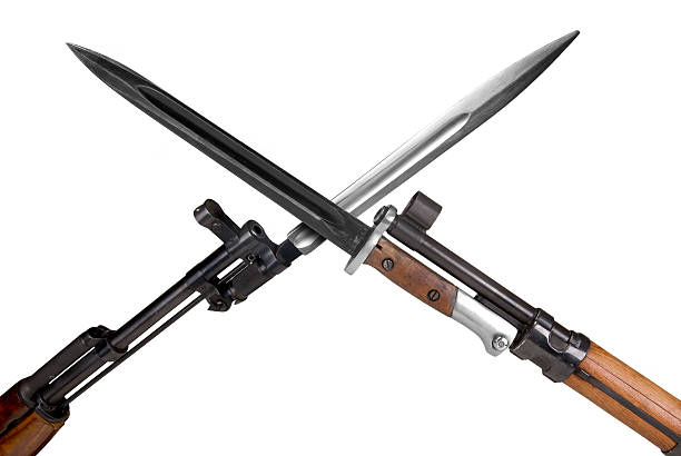 Military Rifles with bayonets crossed isolated over a white background