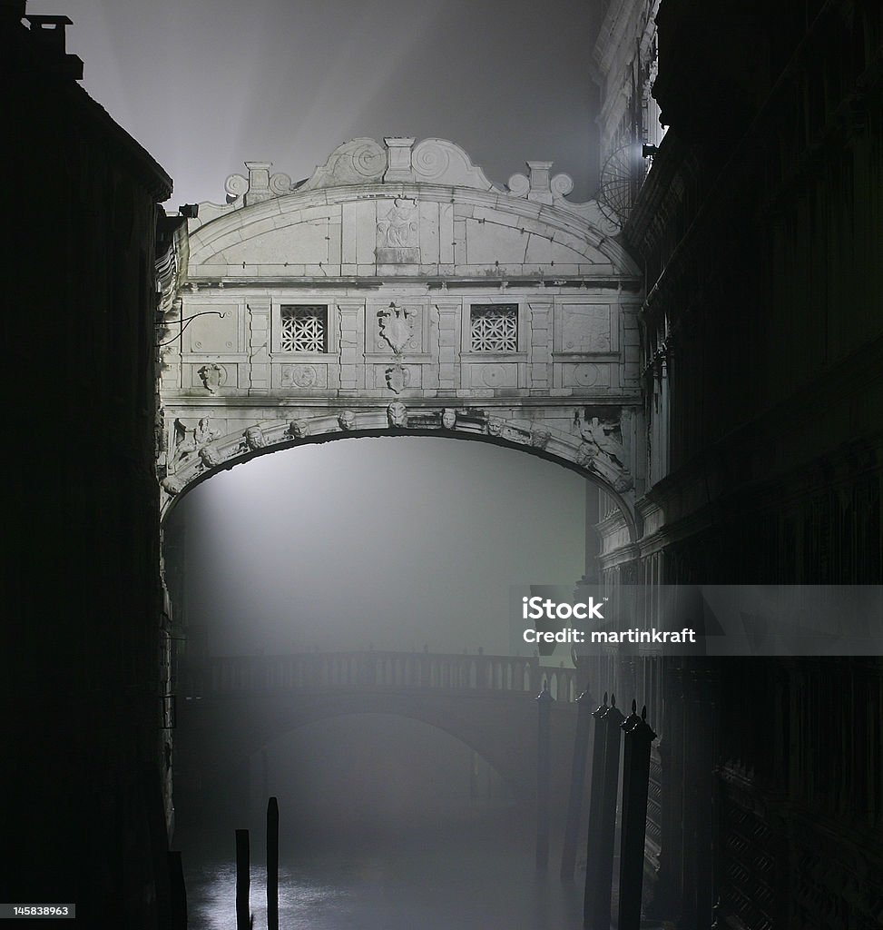 Bridge of Sighs The Bridge of Sighs (Ponte dei Sospiri) in Venice leads from the Doge's Palace to the prison across the canal. photographed in a misty night. Mystery Stock Photo