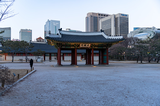 Seoul, South Korea - January, 2023:  a traditional gate in a palace of Josun Dinasty(the meaning of character written in Chinese letter is  gate of glory, and it is pronounced 'Gwangmeyong moon'.