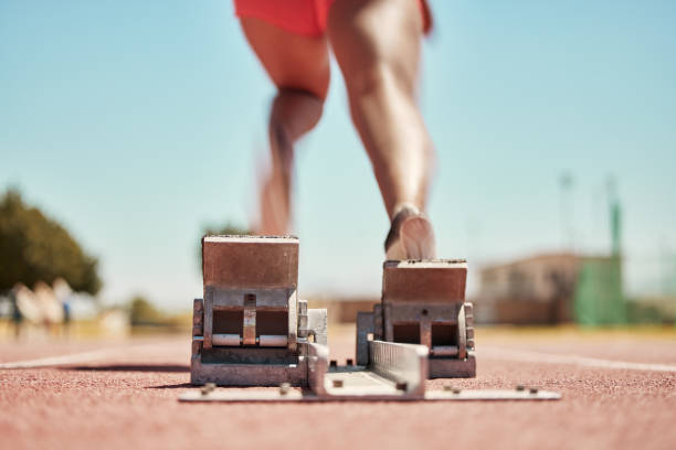 Man starting the sprint race on running track on stadium.