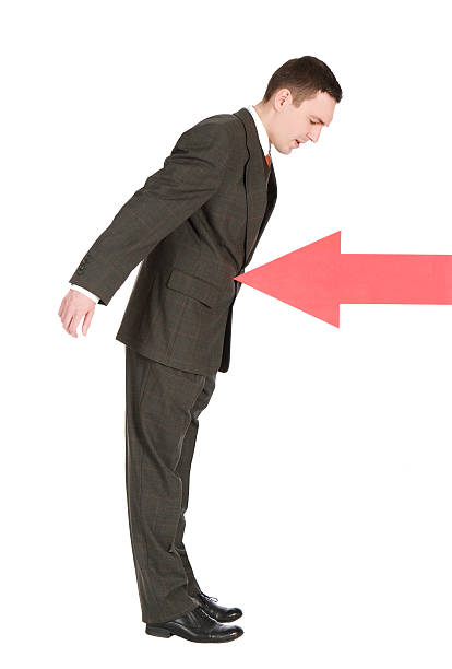 istock businessman stopped with red arrow 145840140