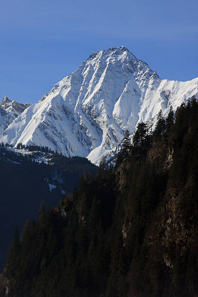 Mountain peak covered with snow stock photo