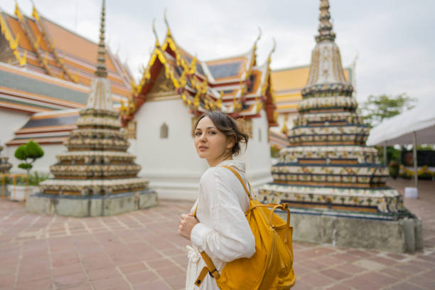 istock Woman exploring  Wat Pho in Bangkok 1458414716