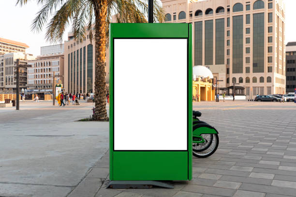 istock an empty white screen on a street billboard. Mock up Screen Background for Various Billboards and Information 1458417913