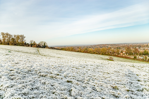 Falling snow over winter landscape with copy space