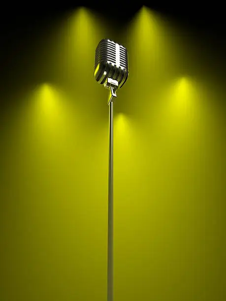 Photo of Vintage silver microphone under green stage lights
