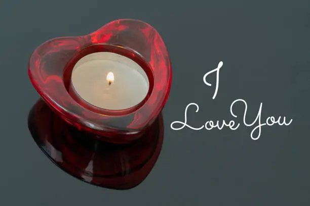 I love you message - Valentine's day, decorative candle on dark background