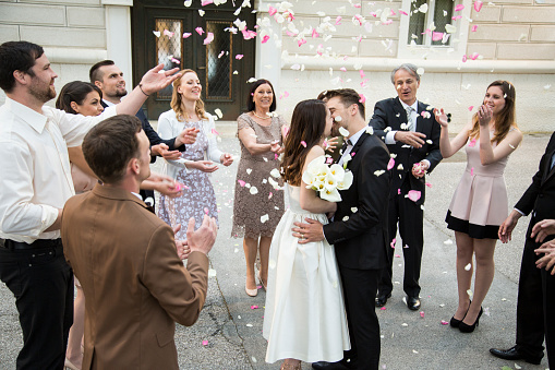 bride groom wedding photo taken with drone in front of classic car