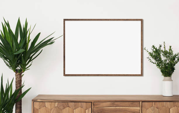 istock Artwork mockup in interior design. Blank picture frame on a wall. Horizontal orientation 1458423474