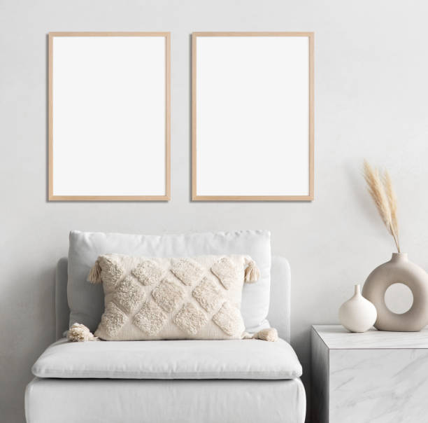 istock Two artwork mockups in interior design. Blank picture frames on a wall. Vertical orientation 1458423488