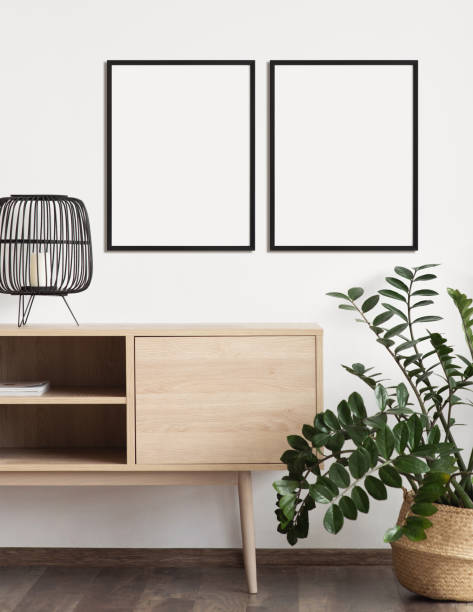 istock Two artwork mockups in interior design. Blank picture frames on a wall. Vertical orientation 1458423503