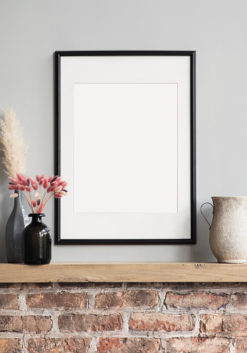 View of modern interior design. Minimalism rustic style. Blank white empty frame mock up for painting or poster.