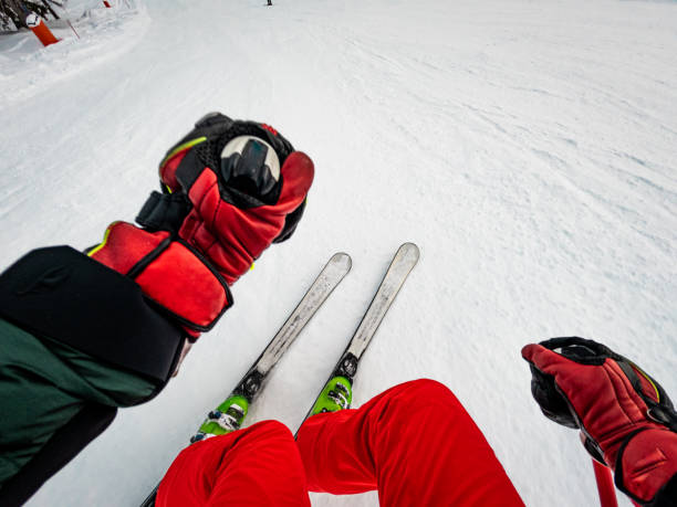 istock POV alpine skiing downhill on a groomed track 1458423588
