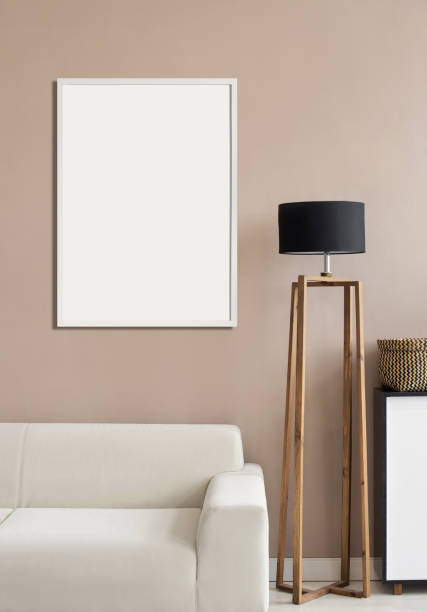 istock Artwork mockup in interior design. Blank picture frame on a wall. Vertical orientation 1458423739