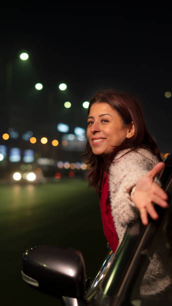 istock Happy young Indian woman at night 1458424537