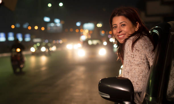 istock Happy young Indian woman at night 1458424589