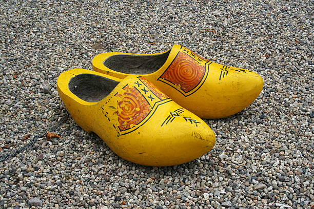 istock Duch wooden shoes - clogs on the peeble 145842824