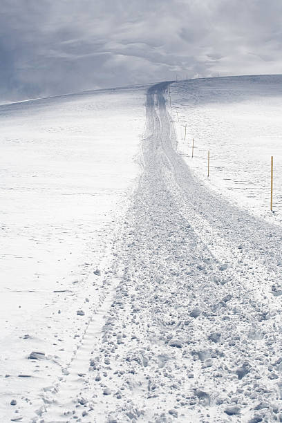 Close up of snow track after groomer stock photo