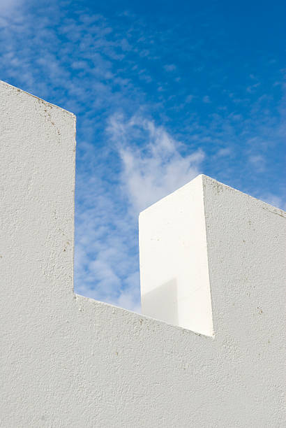 White wall with blue sky stock photo