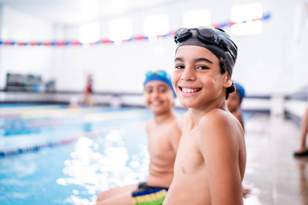 istock Portrait of a boy in the poolside 1458434700