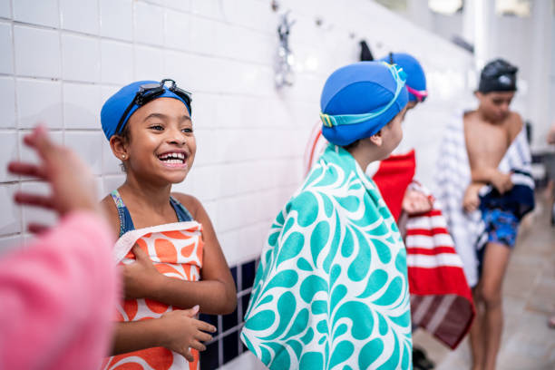 Swimmer girl start from the starting table in the pool
