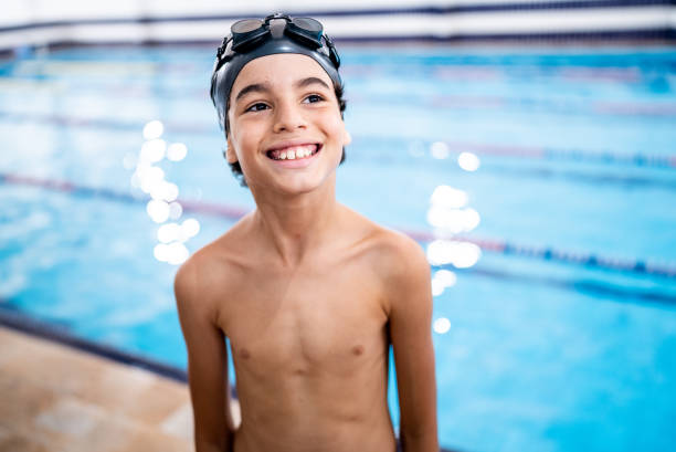 istock Boy looking away contemplating in the poolside 1458435031