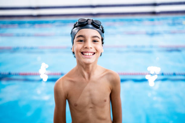 istock Portrait of a boy in the poolside 1458435032