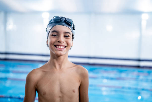 istock Portrait of a boy in the poolside 1458435901