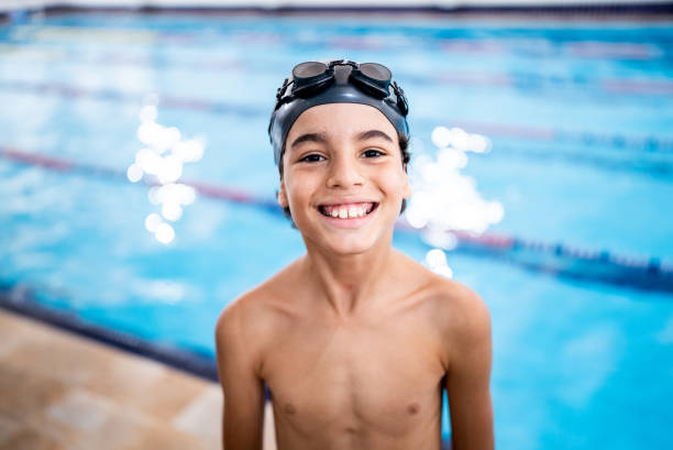 istock Portrait of a boy in the poolside 1458435907