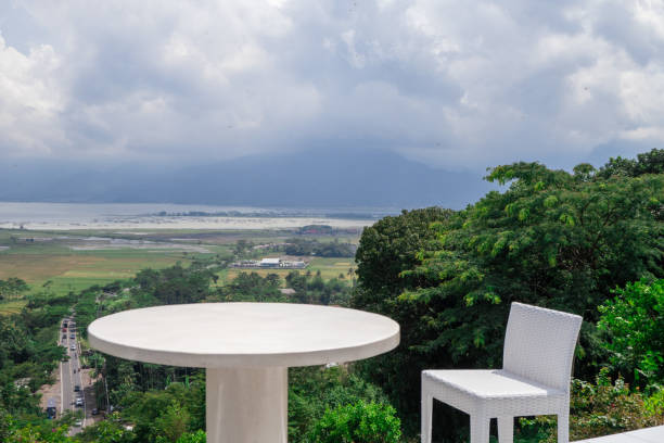 istock Empty white chair and table with beautiful background and cloudy sky. 1458441205