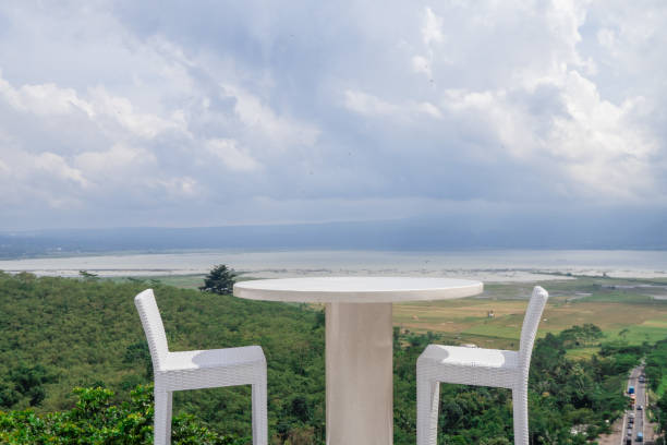 istock Empty white chair and table with beautiful background and cloudy sky. 1458441257