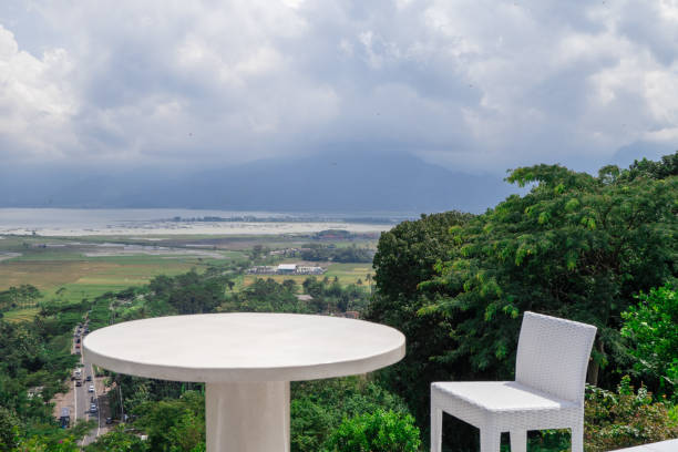 istock Empty white chair and table with beautiful background and cloudy sky. 1458441262