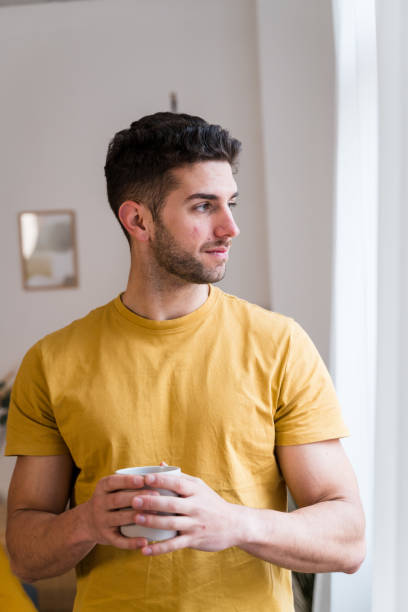 istock Man with cup of coffee 1458442668