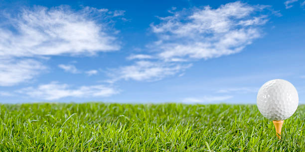 istock A golf all on a yellow tee stuck in the grass 145844351