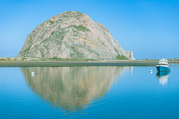 Morro Rock is a large volcanic plug located in Morro Bay, California that rises over 500 feet above the surrounding land.