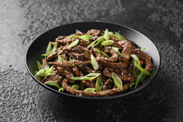 istock Korean beef Bulgogi BBQ with sesame seeds and spring onion. 1458445496