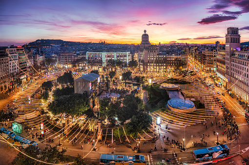 Catalonia square (Plaça de Catalunya) at sunset with christmas lights in Barcelona. Spain