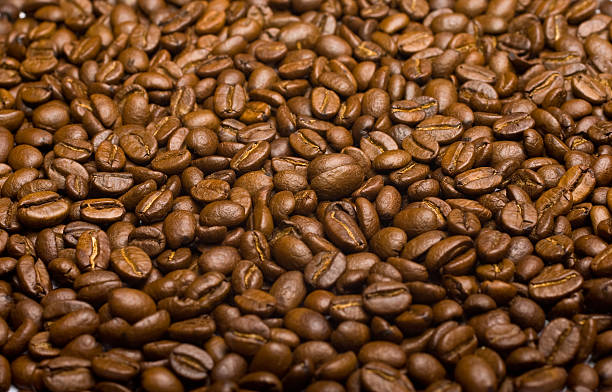 Grãos de café no fundo (close-up - fotografia de stock