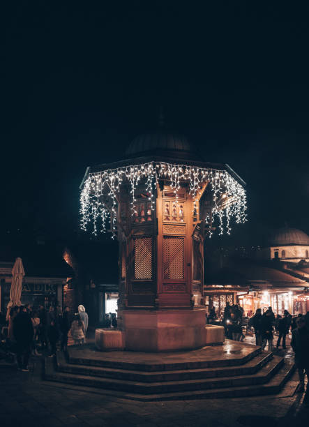 istock Sarajevo clock tower and Sebilj by night 1458450085