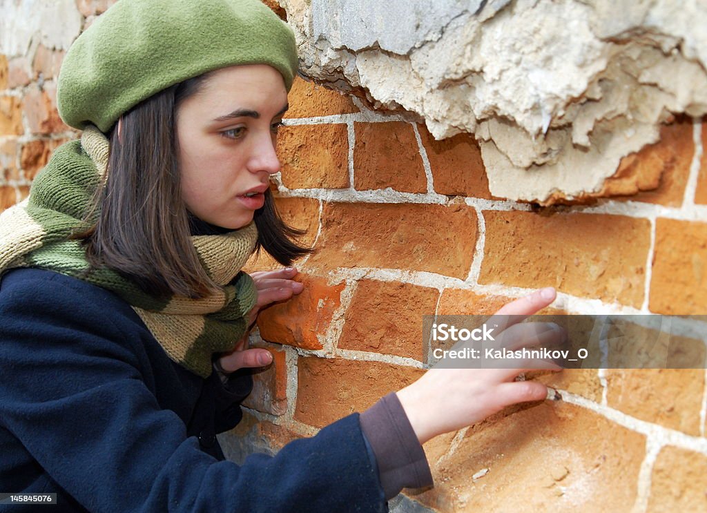 Girl near the wall Teenage girl near the wall Adolescence Stock Photo