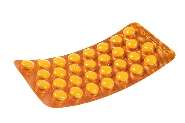 the yellow pills stock photo