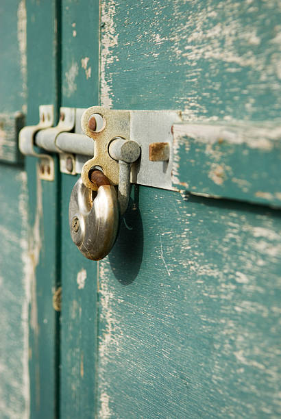 padlock on wooden doors stock photo