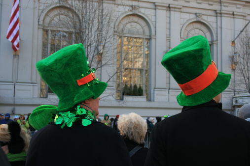 Two men is novelty hats watching the St. Patricks Day Parde in Manhattan.