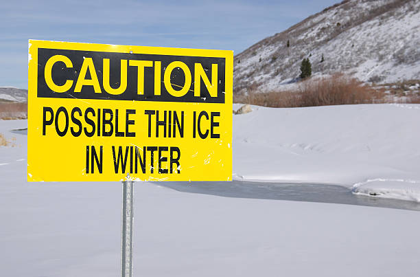 Caution Thin Ice sign. stock photo