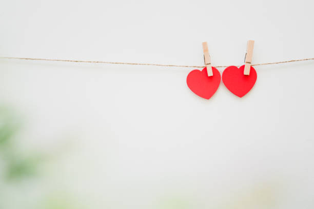 istock paper heart shape hanging on string, love valentine concept 1458461252