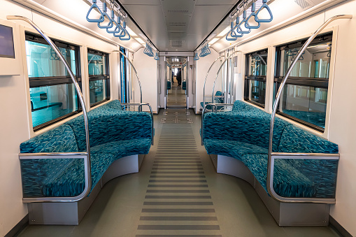 Interior of a passenger train with empty seats, no people during quarantine lockdowns in Germany. inside the subway car.