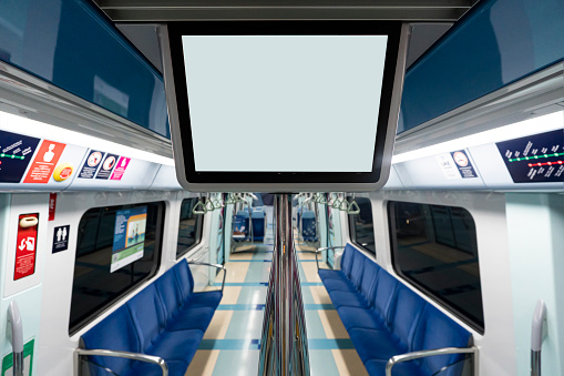Blank white information billboard in public subway. a blank screen in a subway car or urban public transport,